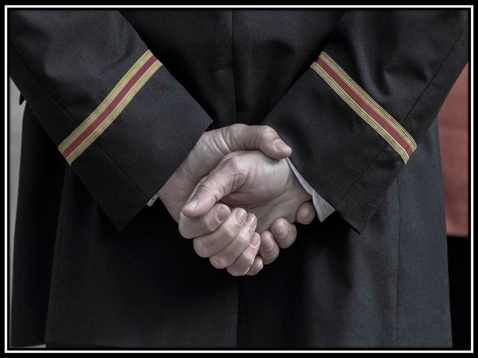 Body language Hands clasped in front