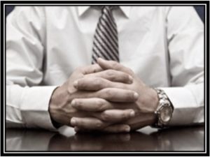 Man clasping hands in front