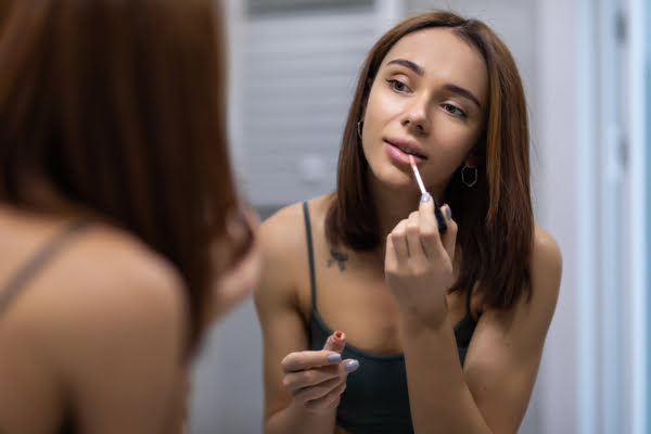 cheating woman putting makeup