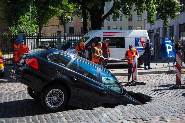 car in pothole