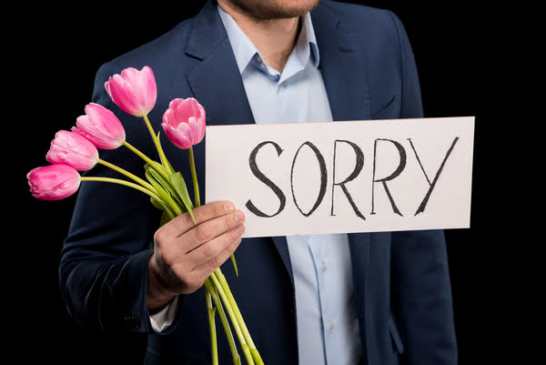 man apologizing