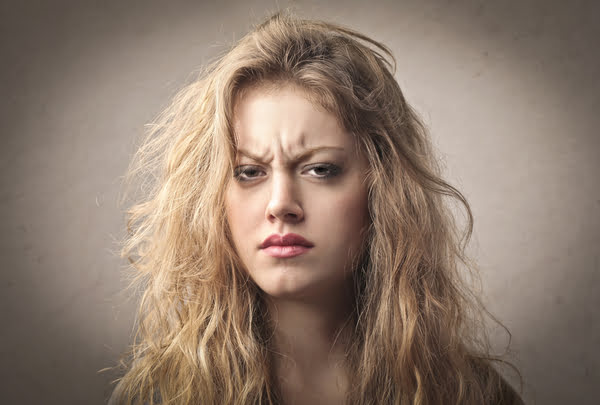 woman with furrowed brows