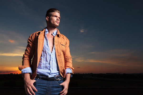 Young man standing with hands in pockets by Edyta Pawlowska, via  ShutterStock | Male pose reference, Standing poses, Hands in pocket pose  drawing